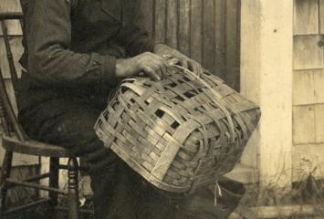 Claxton family member making basket