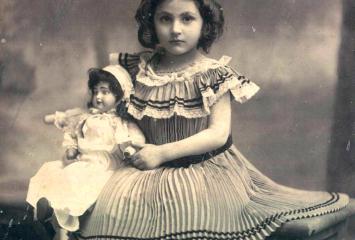 Unidentified girl with a doll